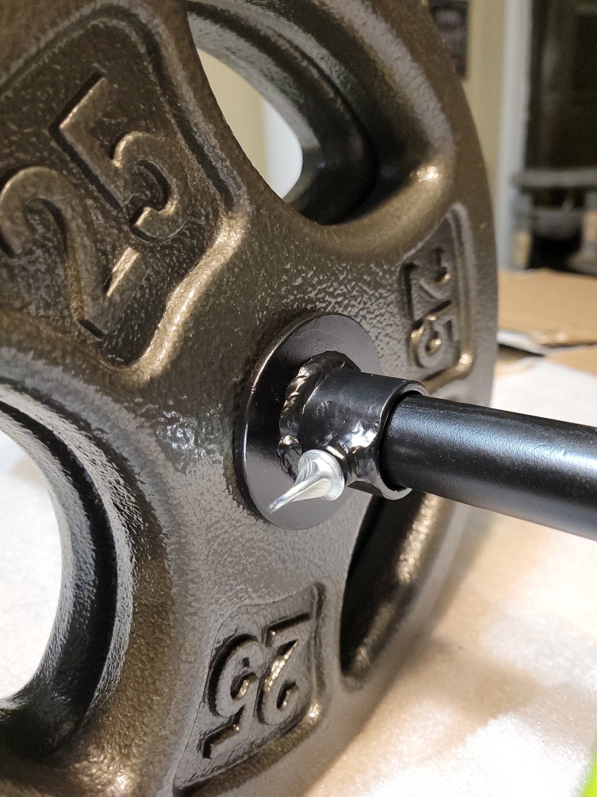 Adjustable barbells installed on 1 inch barbell
