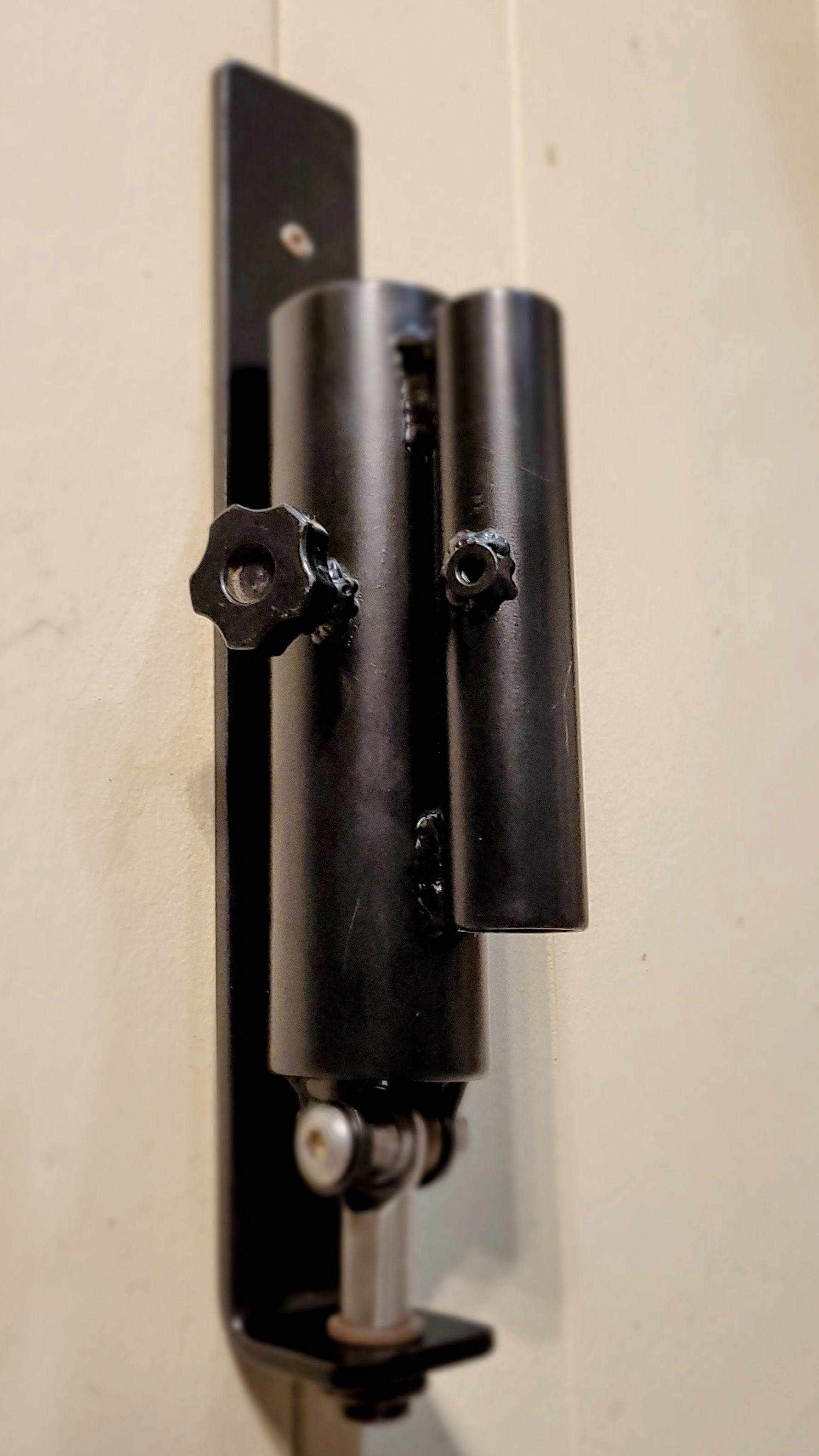 Front view of the Wall Mounted Landmine featuring adjustable knobs and dual sleeve design for 1" and 2" barbells in home gym setups.
