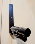 Angled view of the Wall Mounted Landmine showing its heavy-duty steel build and wall attachment for versatile barbell training.