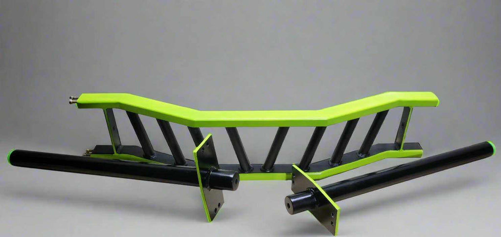 Disassembled view of the cambered barbell showing modular components and angled grip design for customizable lifting.