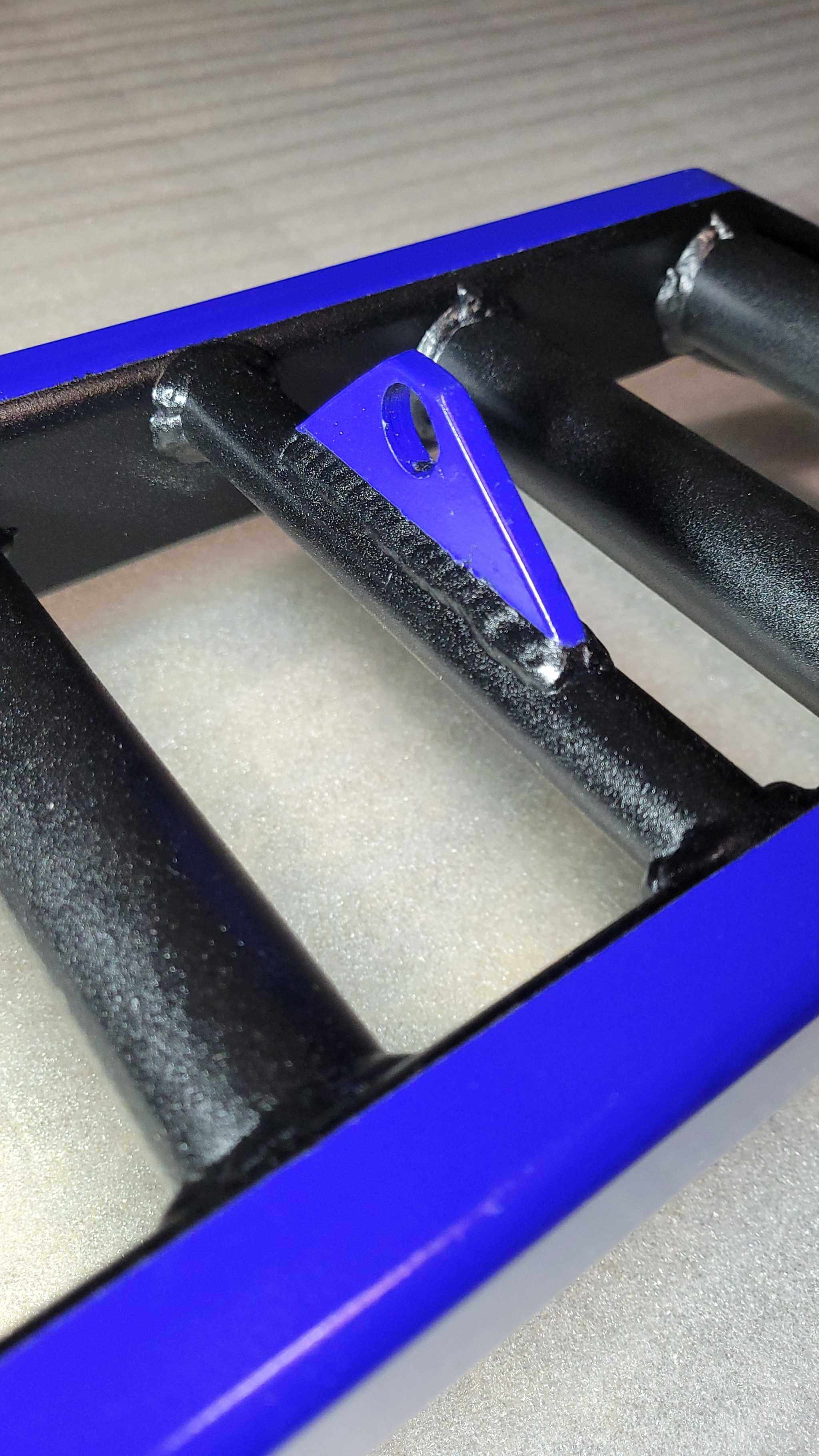 Zoomed-in shot of the grip section and attachment point on the Heavy Duty Camber Row Barbell, emphasizing its modular and ergonomic design.