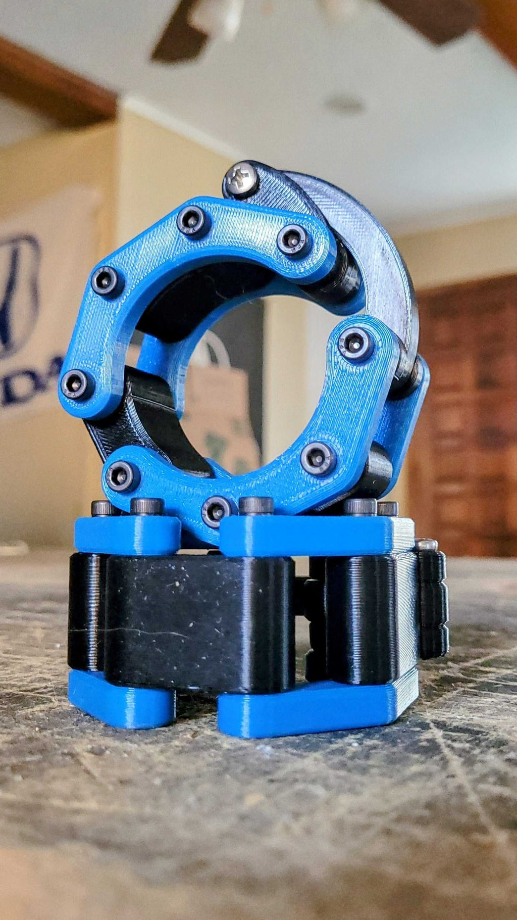 Quick Release Barbell Clamps in blue and black, shown with durable, high-quality design ideal for secure weightlifting.